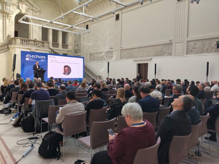 ECHOES event, group of attendees seated in the room in front of the speaker